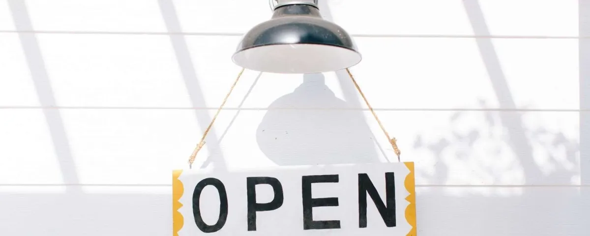 open sign hanging from a farmhouse style outdoor light