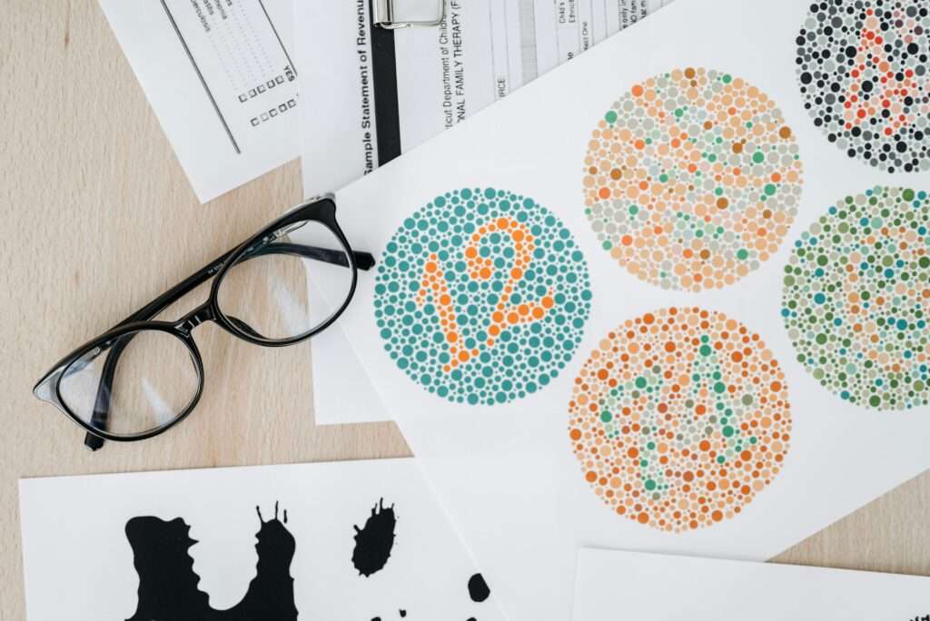 An Ishihara color vision test, with patterns of colored dots with numbers inside of them, which is designed to test for color blindness.