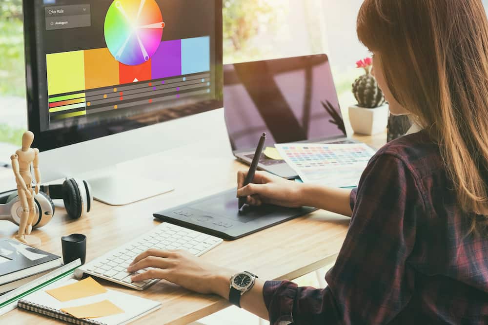 Build authority with website design - designer choosing colors