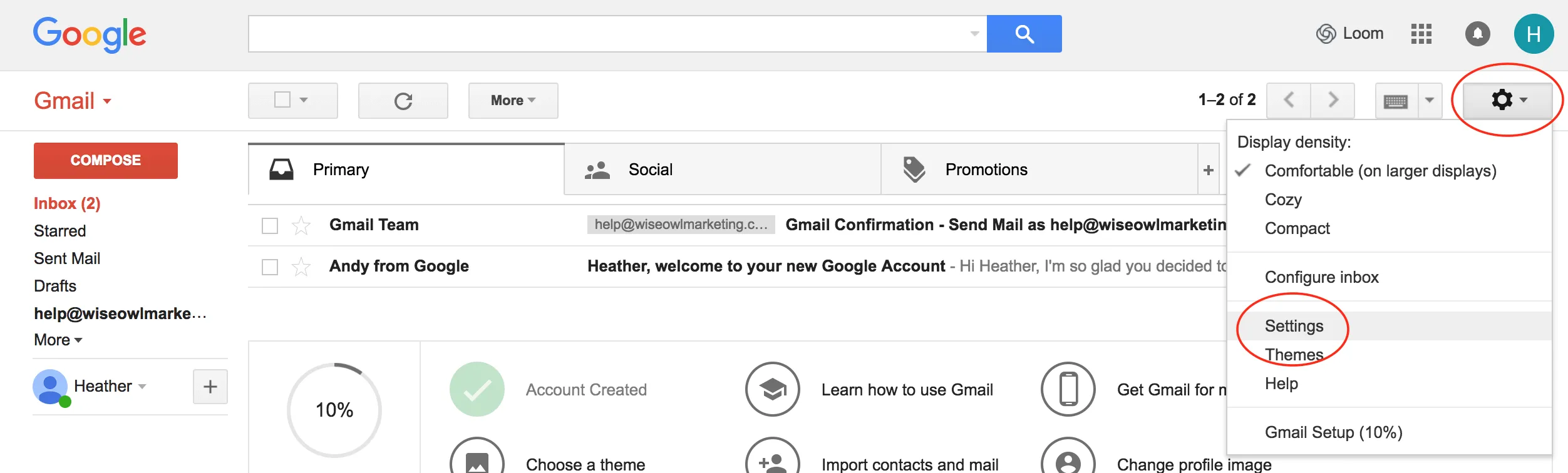 Gmail inbox with the settings gear icon highlighted in the top right corner