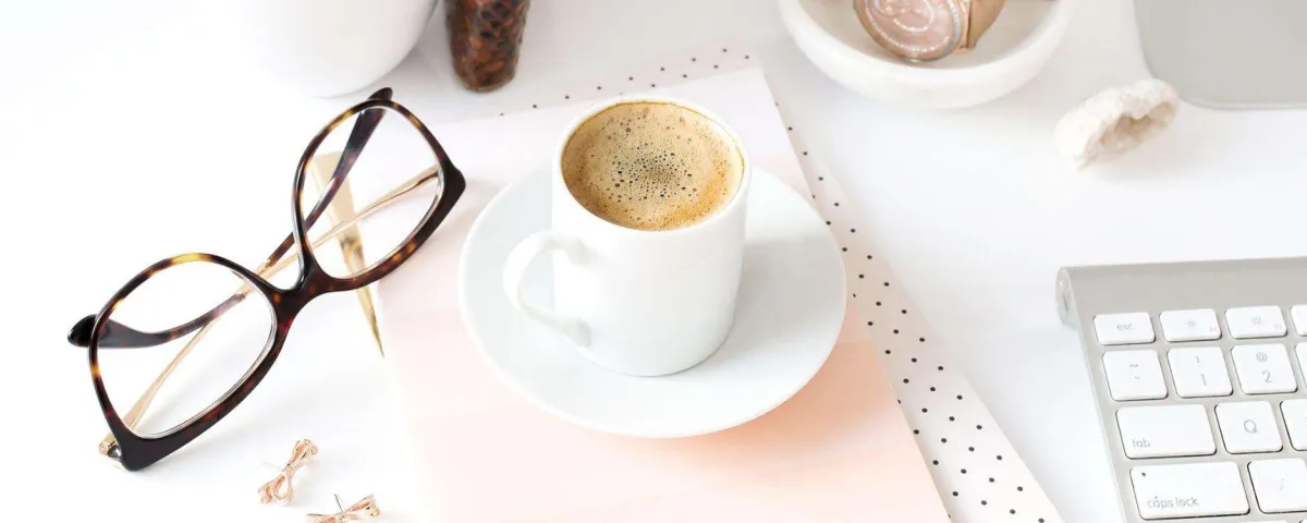mug of espresso glasses and keyboard