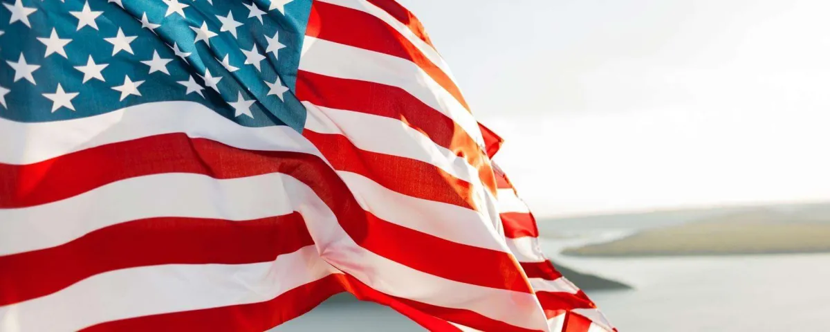 closeup of an American flag blowing in the wind