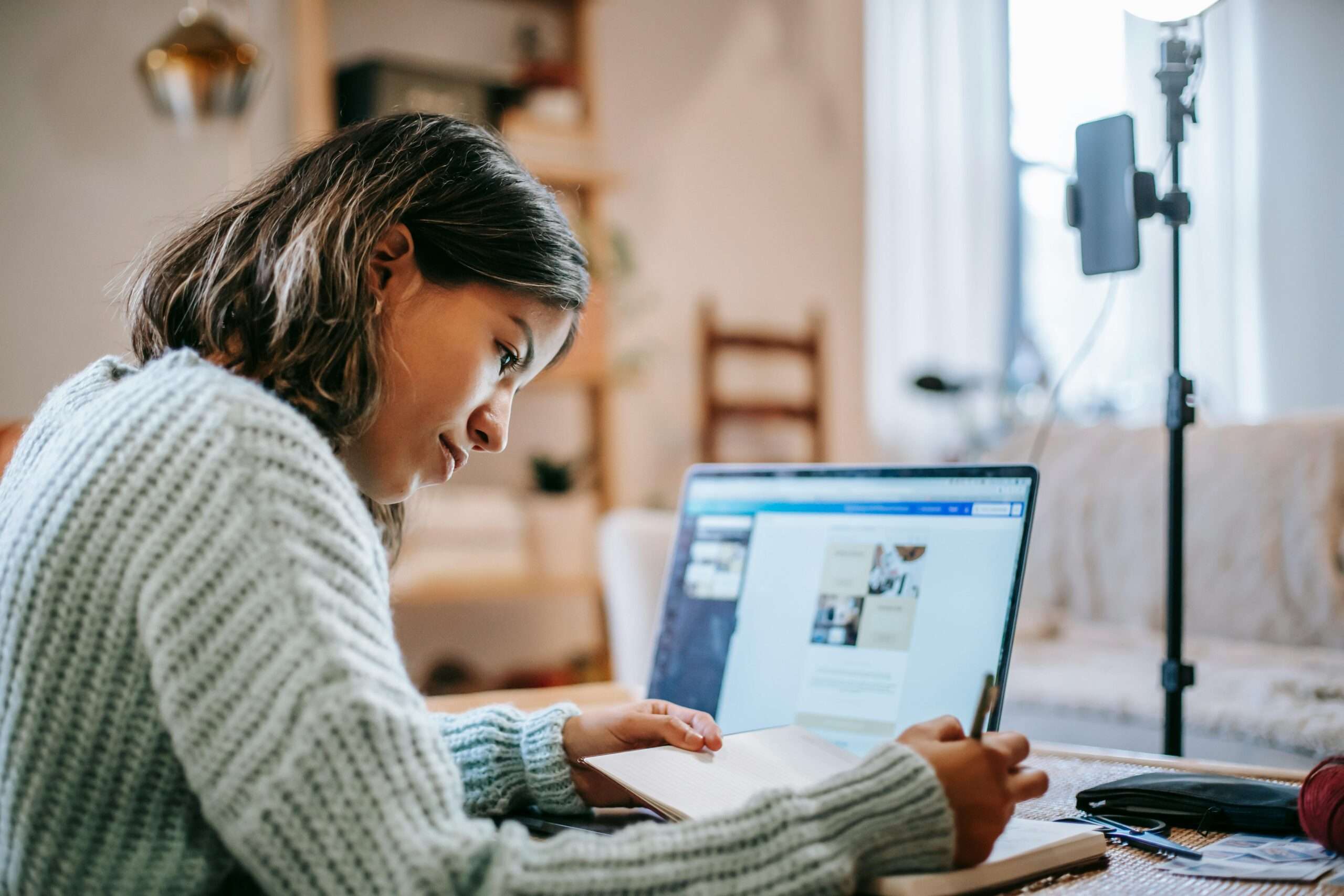 life coach creating content on her laptop