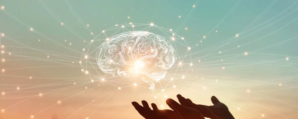 brain hologram hovering over a pair of hands