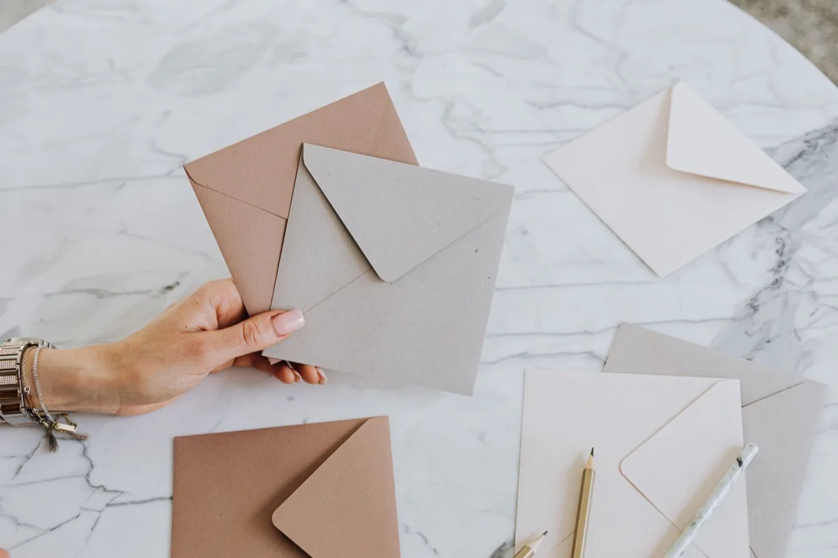 woman holding envelopes