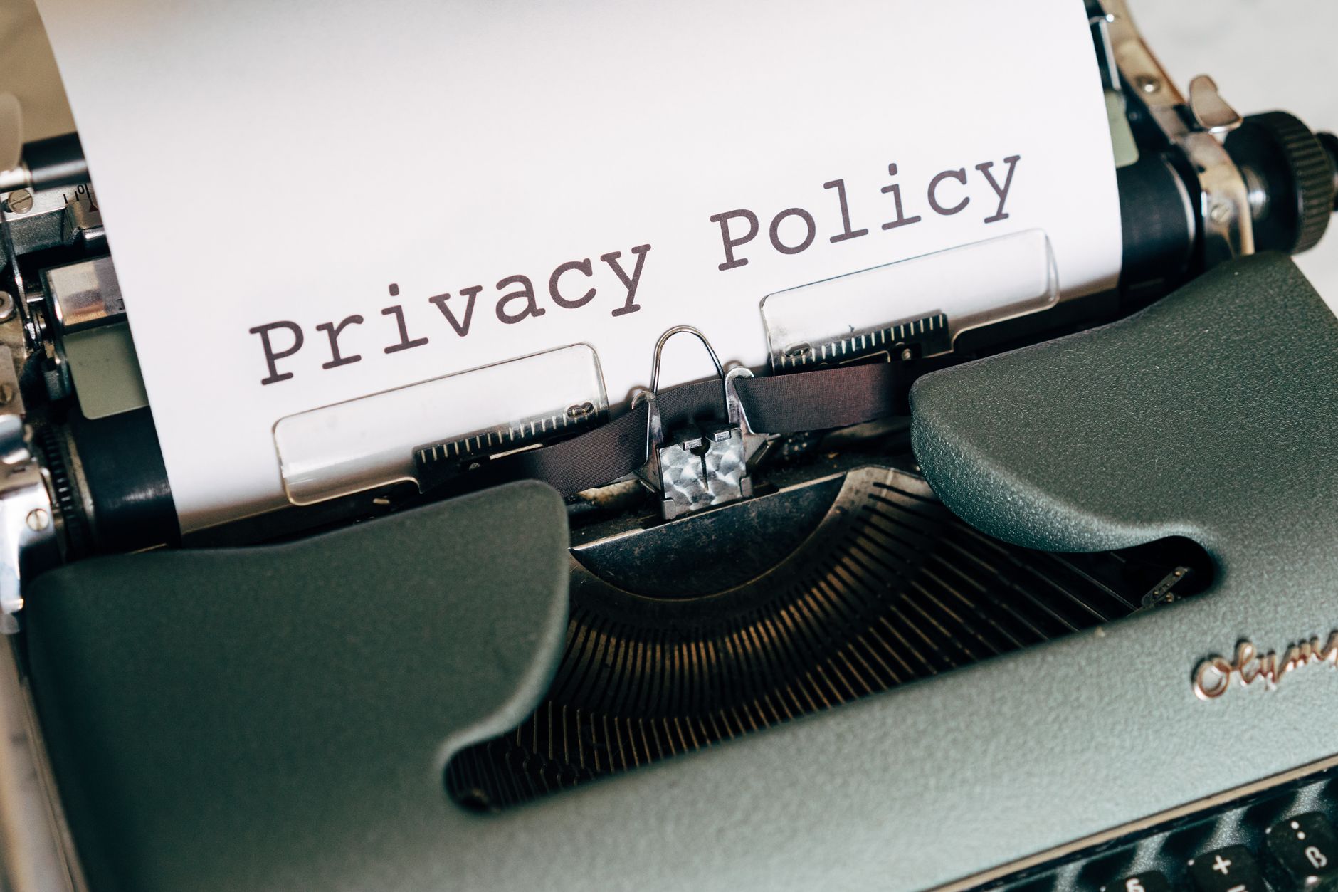 Old typewriter with Privacy Policy typed on a page to represent the Termageddon Privacy Policy tool for coaches and small business websites.