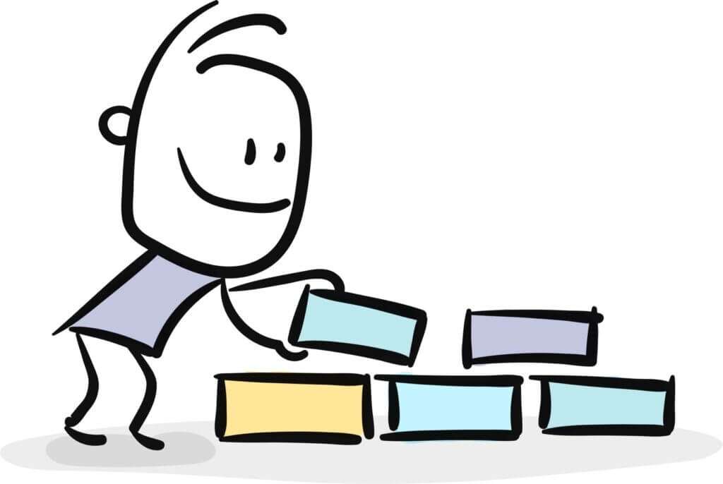 drawing of a happy cartoon boy building something with bricks