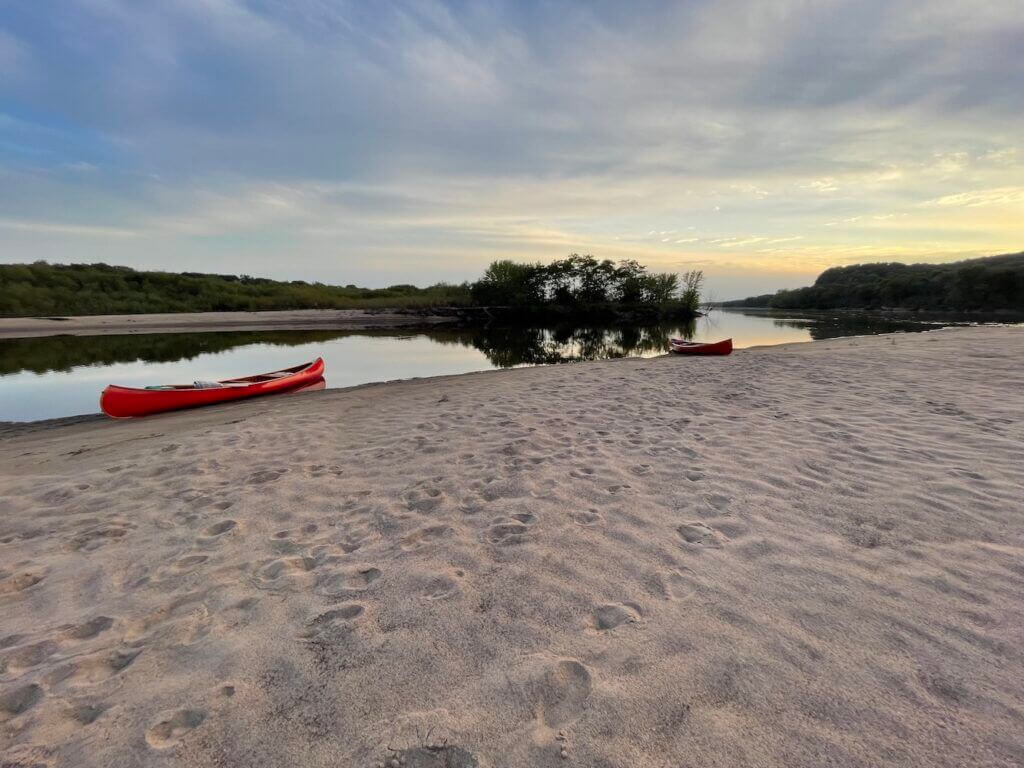 Dad's wooden Old Town canoes on the shore of the Wisconsin River