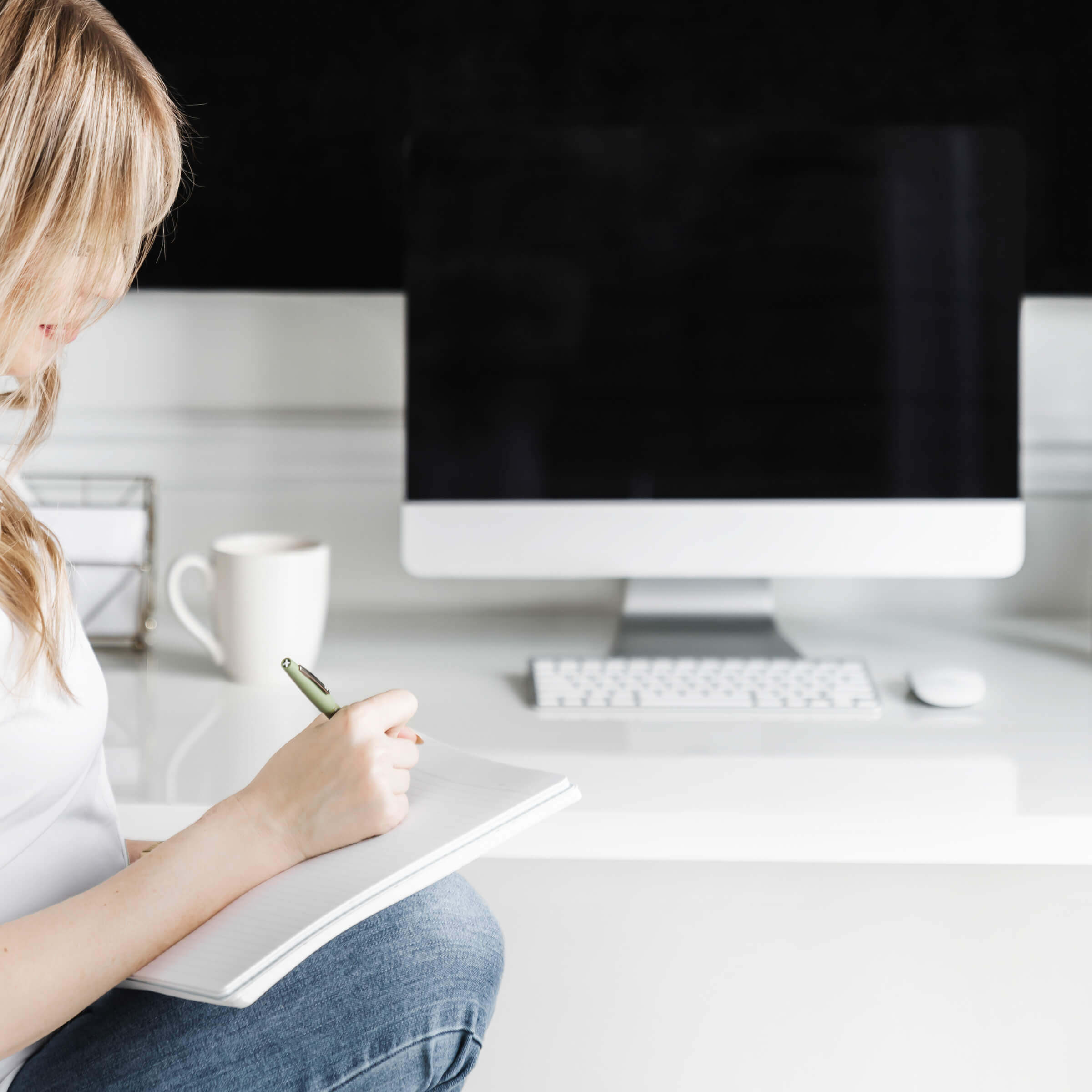image of woman journaling about marketing