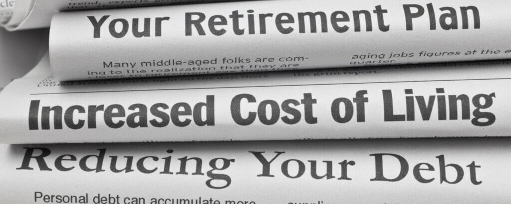 stack of newspapers showing headlines