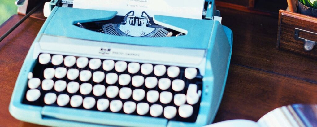 Cool old typewriter on a desk representing long-form content to grow your business in 2026