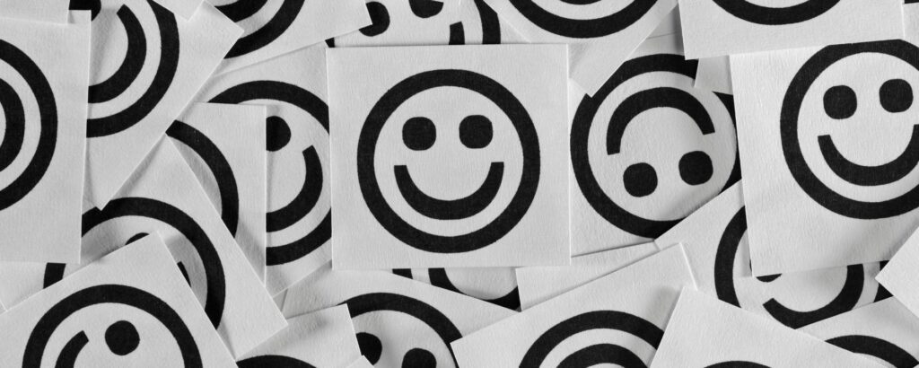 a bunch of black smile faces on white background. Surefire Ways to Improve Your Happiness as a Business Owner