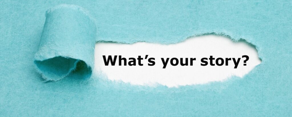 turquoise piece of paper torn to reveal "what's your story" typed on white paper behind it.