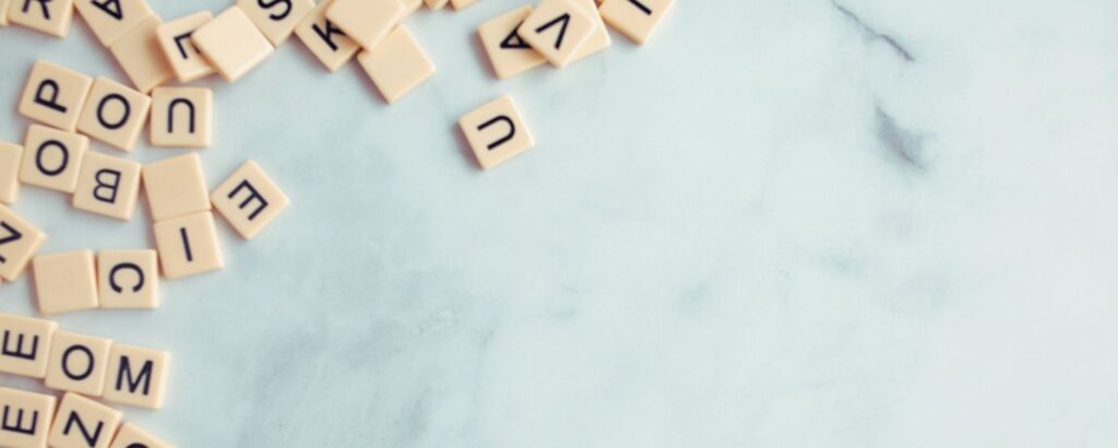 Photo of wooden scrabble tiles in a pile