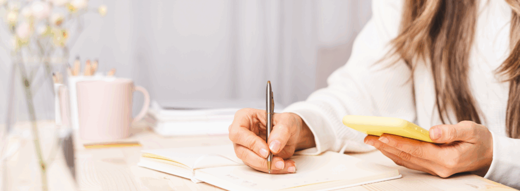 Female business owner sitting at her desk planning her marketing