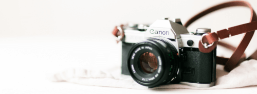A camera sitting on a table for planning a branding photoshoot