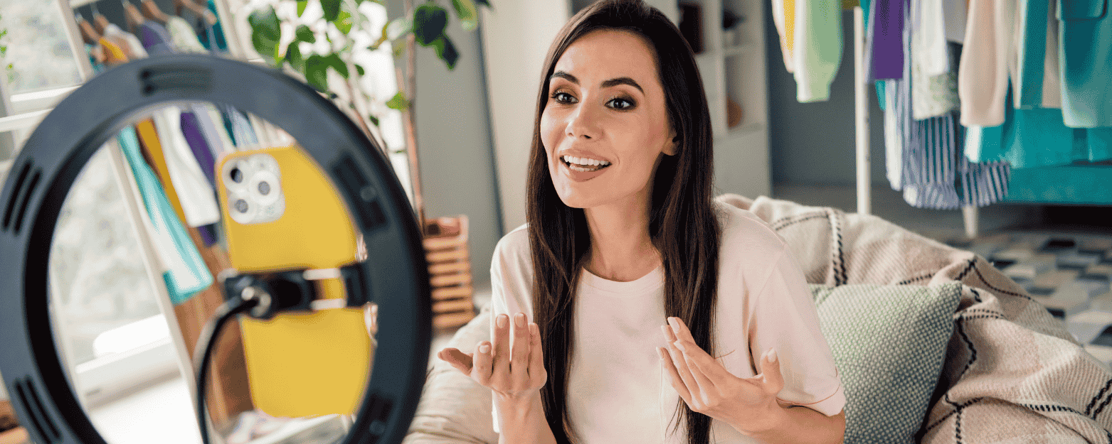 woman recording a video on her iphone