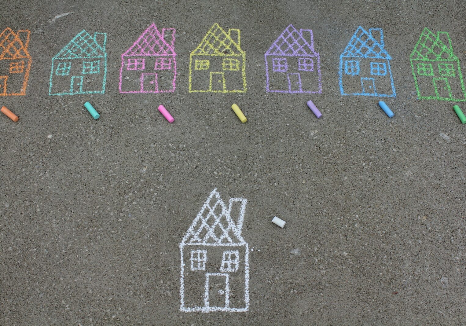 assorted-color house illustration on gray concrete surface