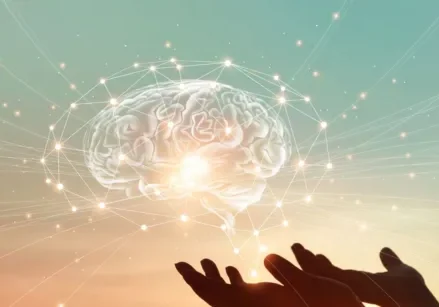 brain hologram hovering over a pair of hands