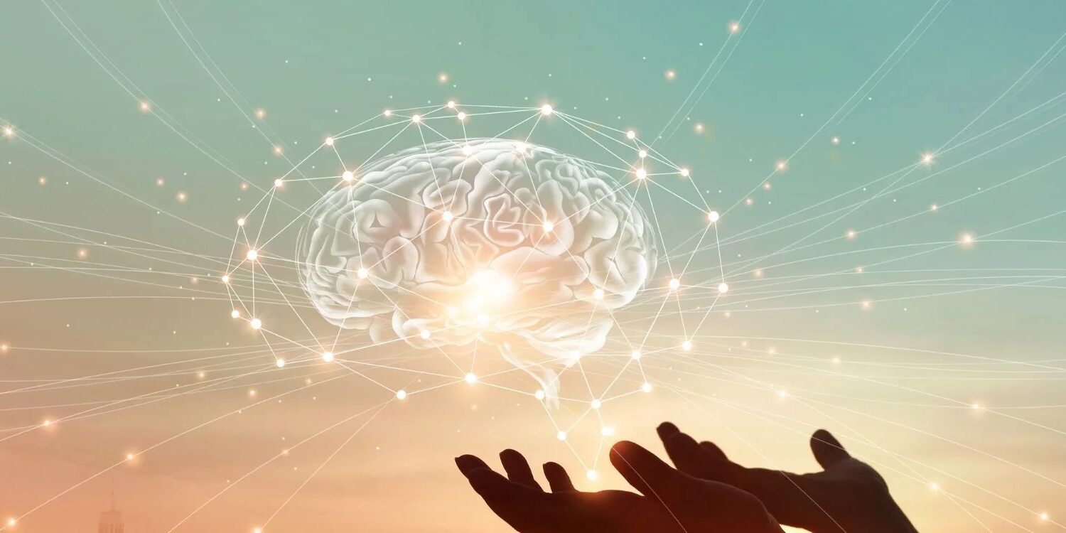 brain hologram hovering over a pair of hands