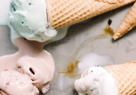 pretty ice cream cones melting on a marble slab