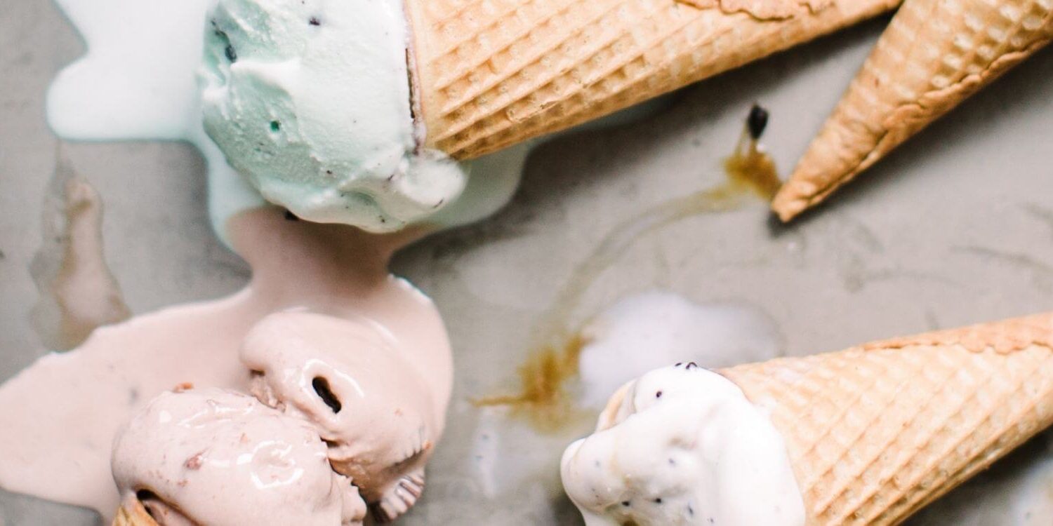 pretty ice cream cones melting on a marble slab