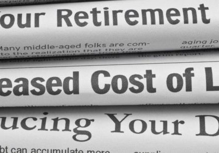 stack of newspapers showing headlines