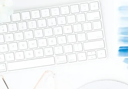 keyboard, watercolor paint swatches in shades of blue