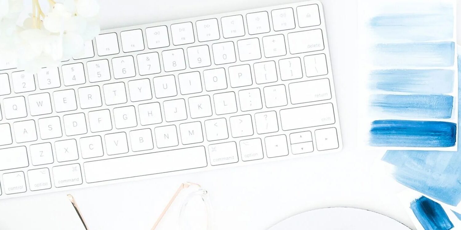 keyboard, watercolor paint swatches in shades of blue