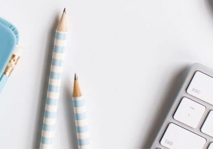 keyboard pencils and notebooks