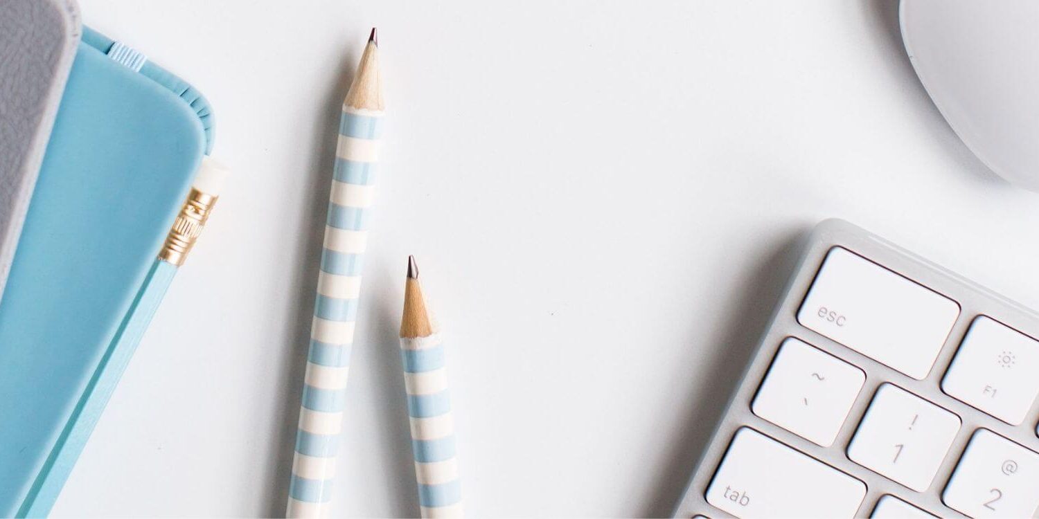 keyboard pencils and notebooks