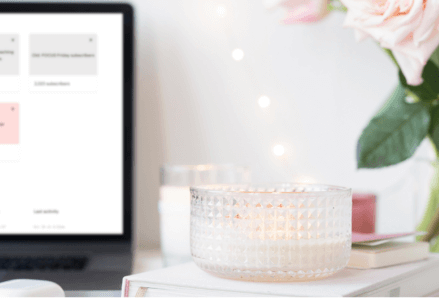 Laptop on a desk showing the Flodesk CRM system on the screen.