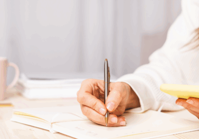 Female business owner sitting at her desk planning her marketing