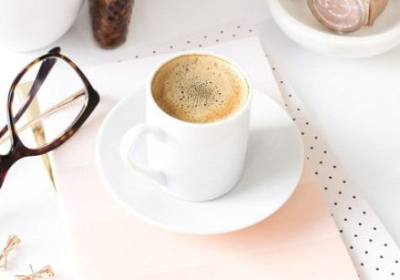 mug of espresso glasses and keyboard