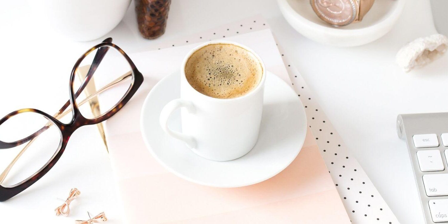 mug of espresso glasses and keyboard