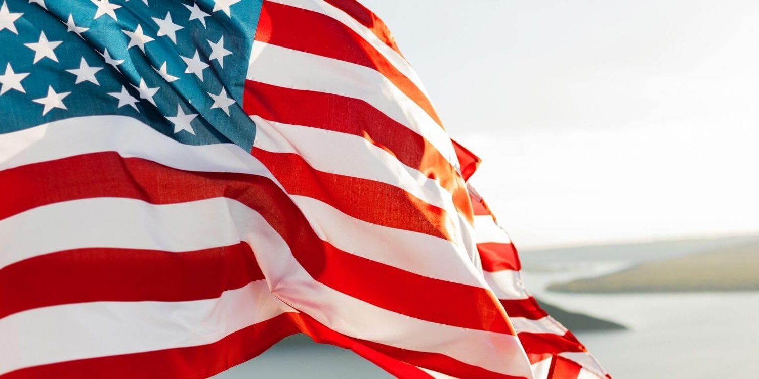 closeup of an American flag blowing in the wind