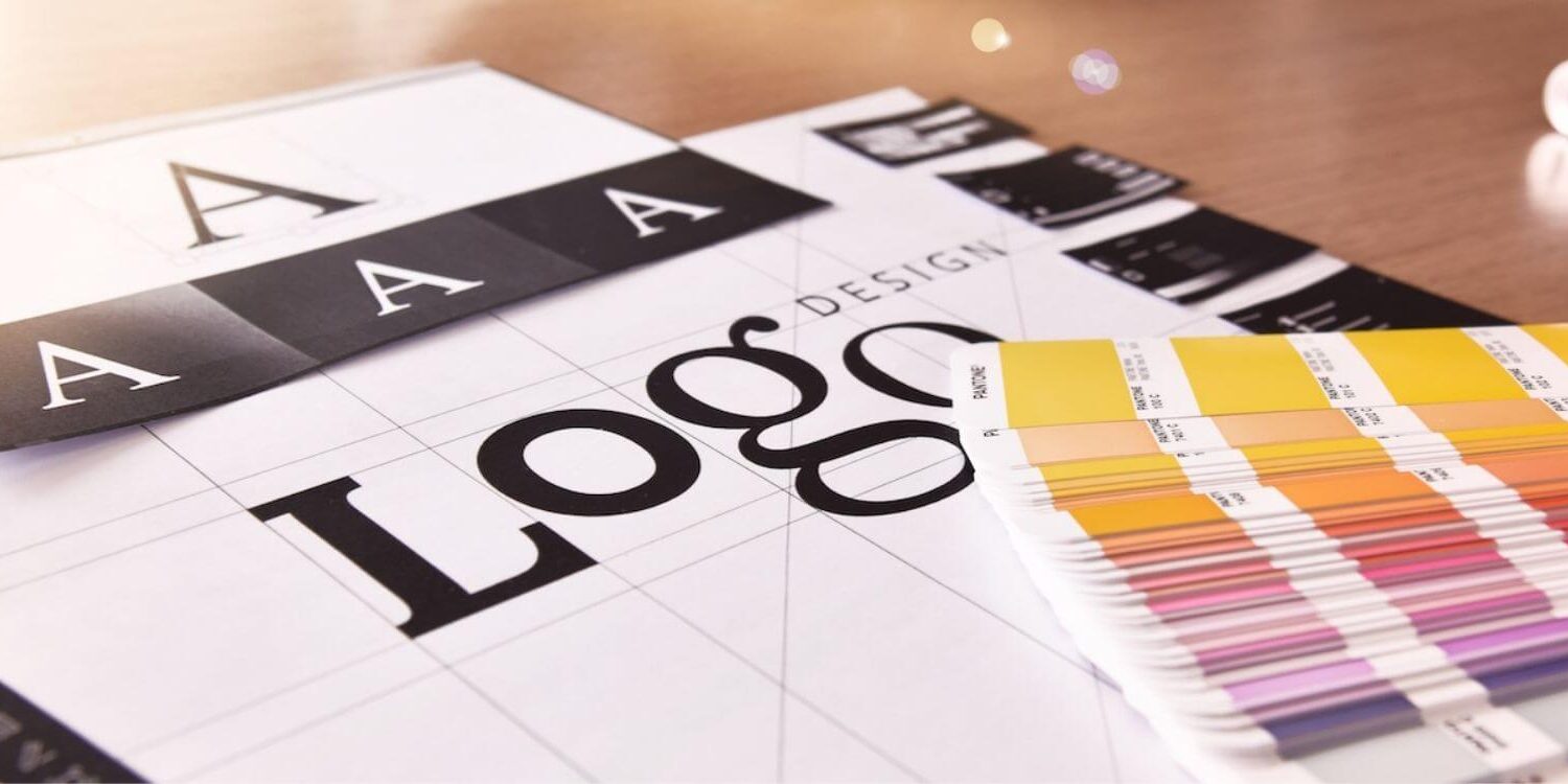 drawing of letters that say LOGO with a fan of color swatches