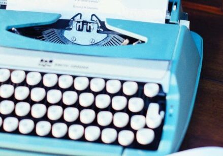 Cool old typewriter on a desk representing long-form content to grow your business in 2026