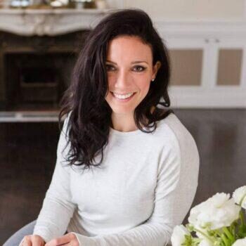 kerin briscese headshot of woman with brown hair and white shirt.