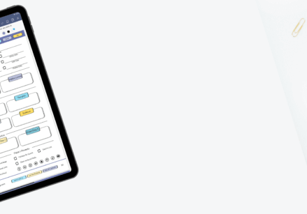 marketing planner on a desk with a plant and paper clips