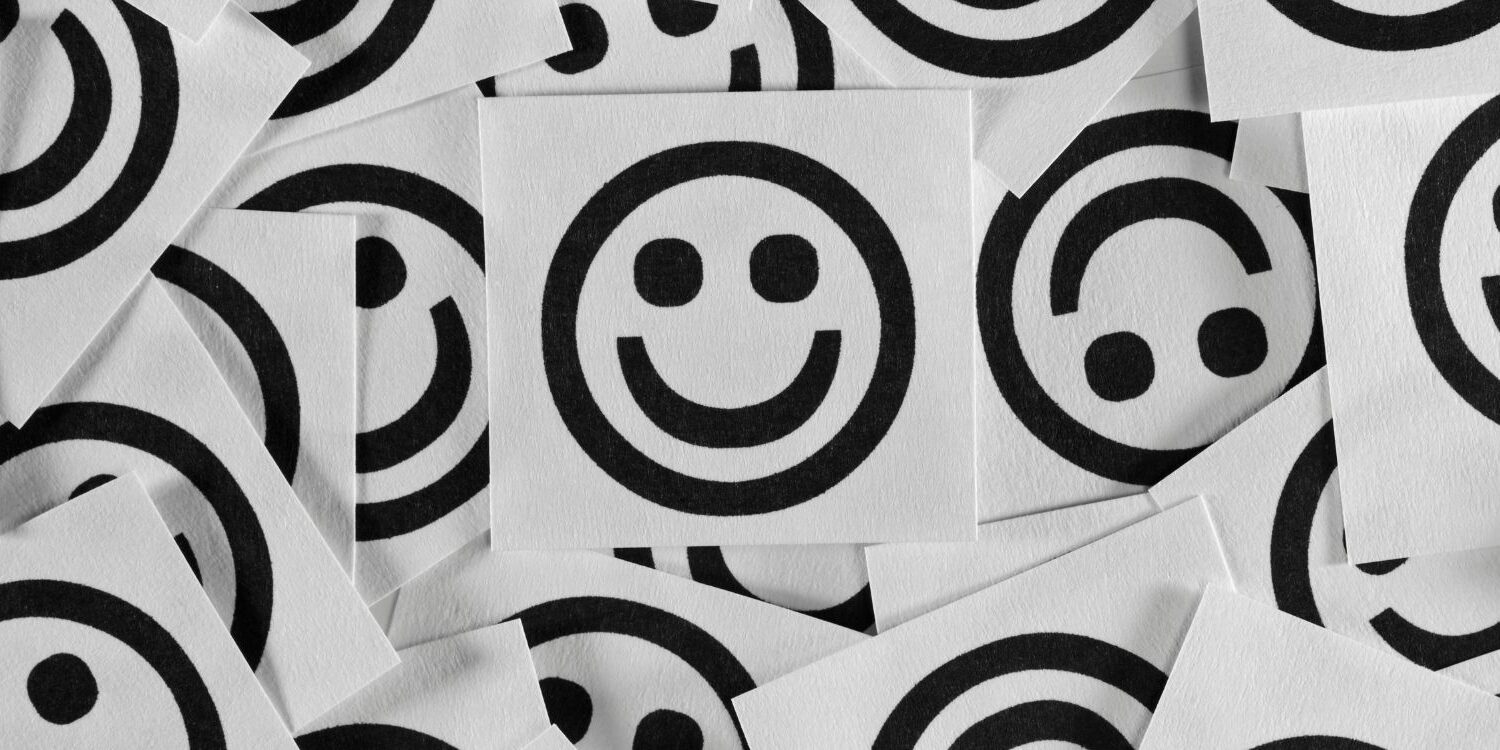 a bunch of black smile faces on white background. Surefire Ways to Improve Your Happiness as a Business Owner