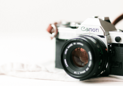 A camera sitting on a table for planning a branding photoshoot