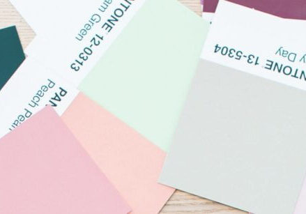 pile of pink, gray, teal, blue color swatches from pantone