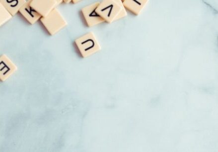 Photo of wooden scrabble tiles in a pile