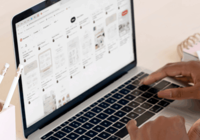 Hands typing on a keyboard as someone is building a website