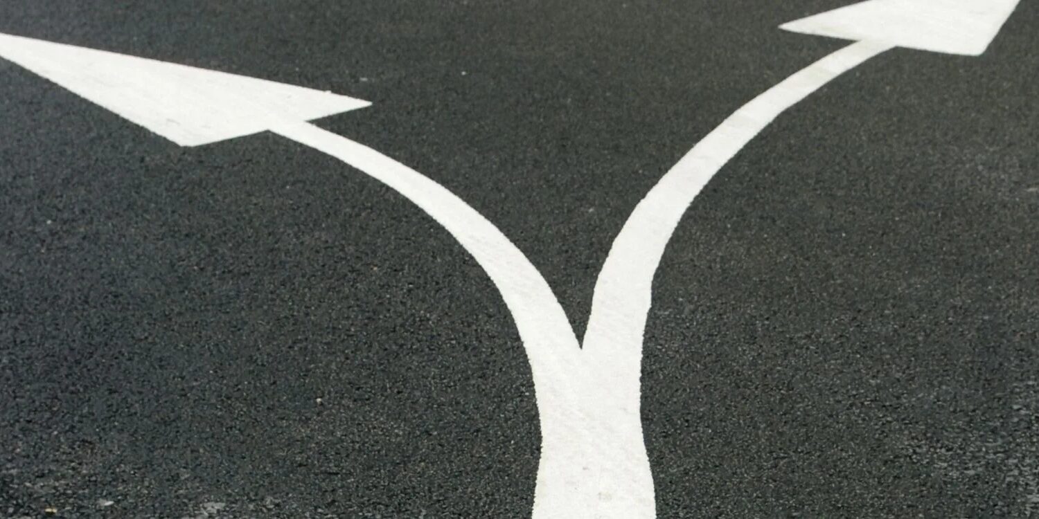 two arrows making a Y and pointing in different directions this or that