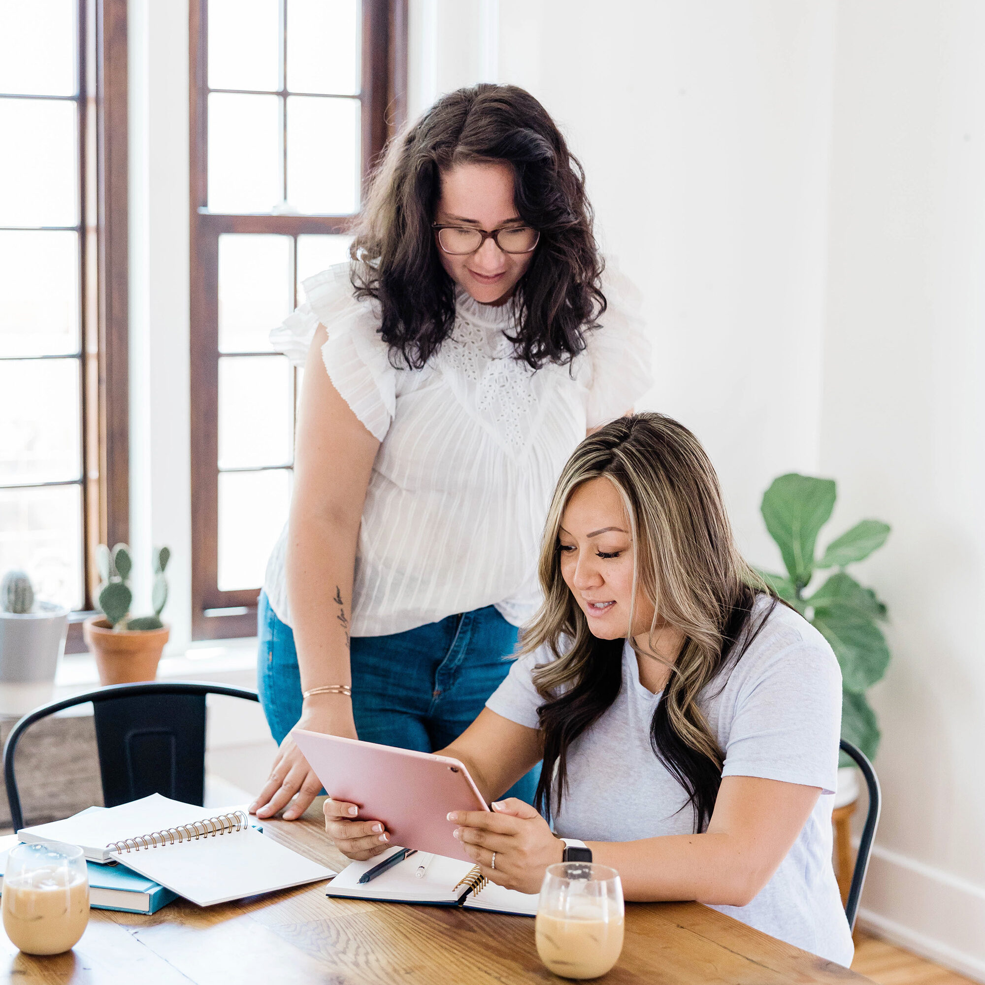 female entrepreneurs looking at an ipad together