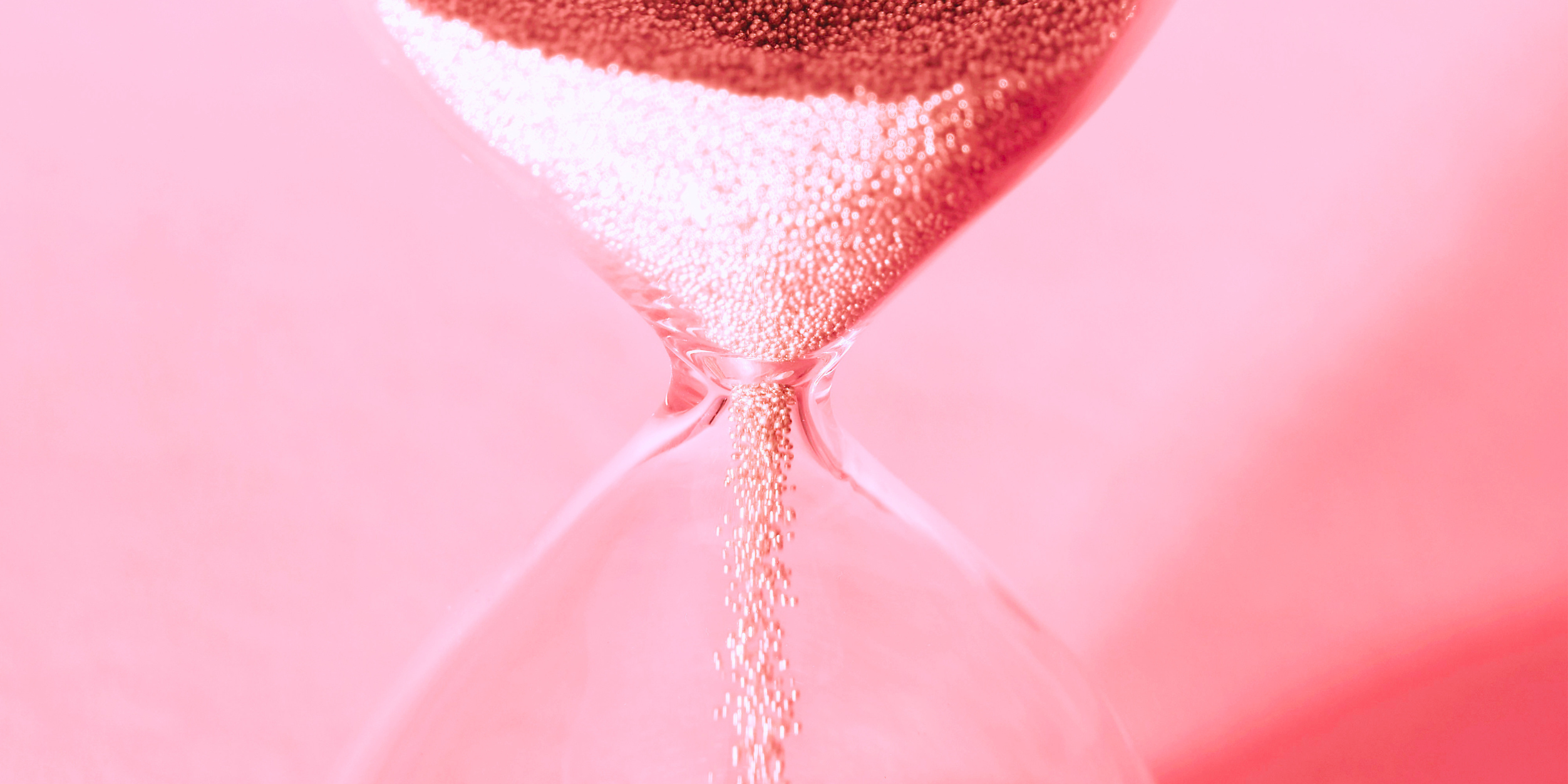 hourglass with sand passing through it representing social media content that disappears vs evergreen searchable content assets that last.