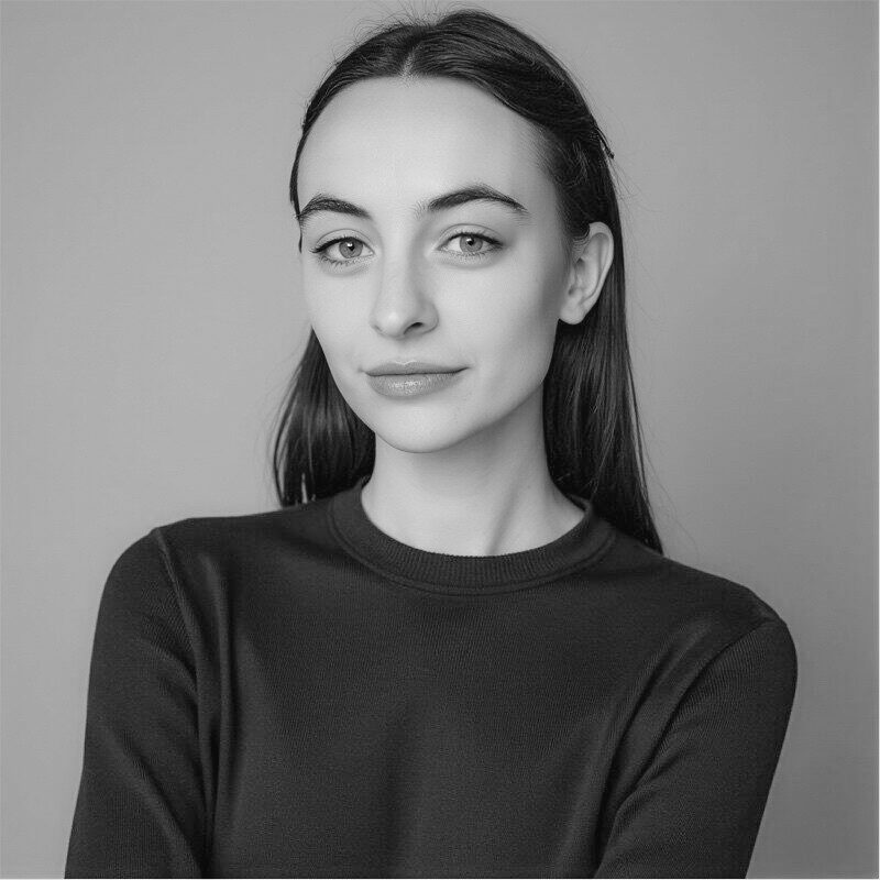 Black and white headshot of Maggie Markham, project manager, a woman with long hair.