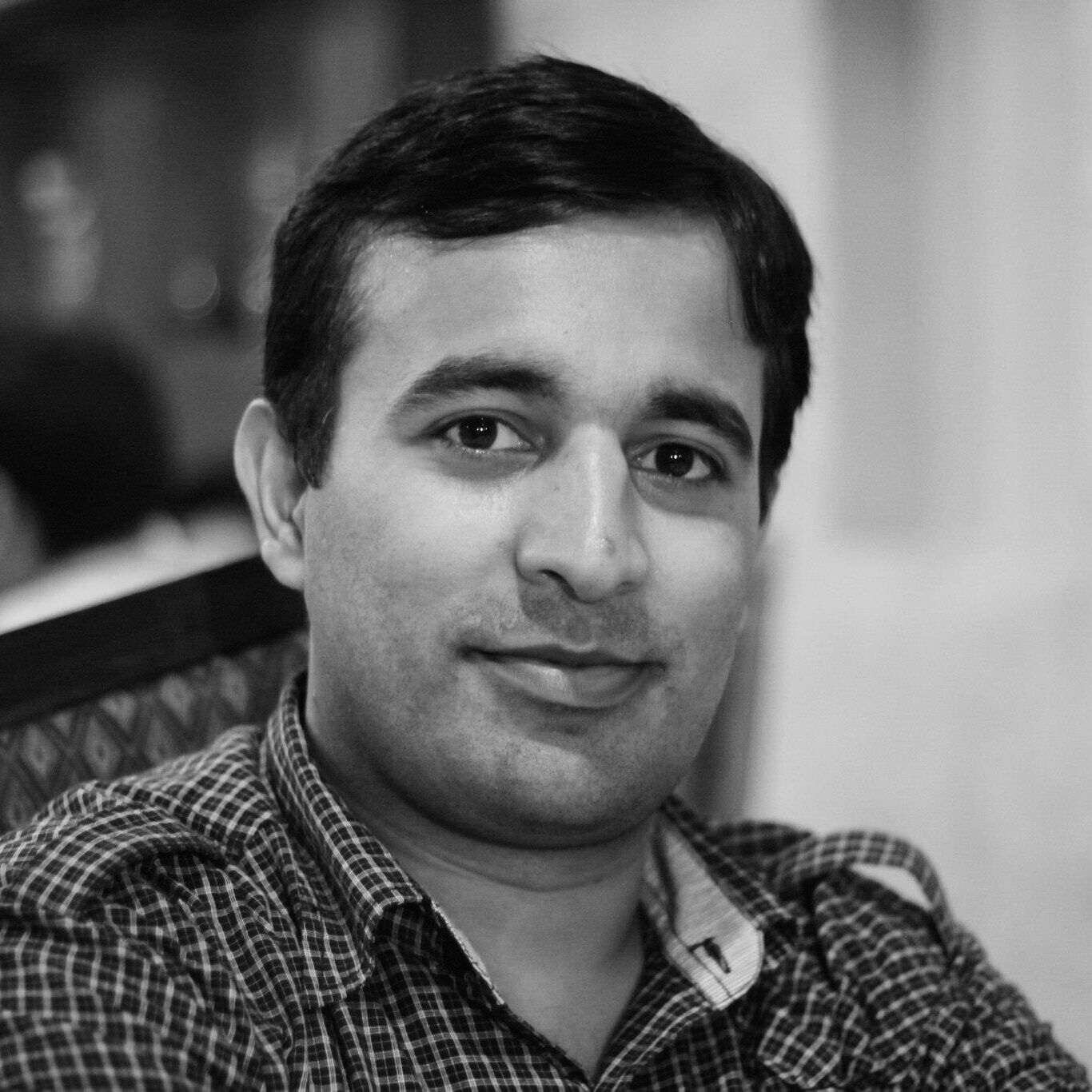 Headshot of Rizwan Mehmood, a man with short dark brown hair